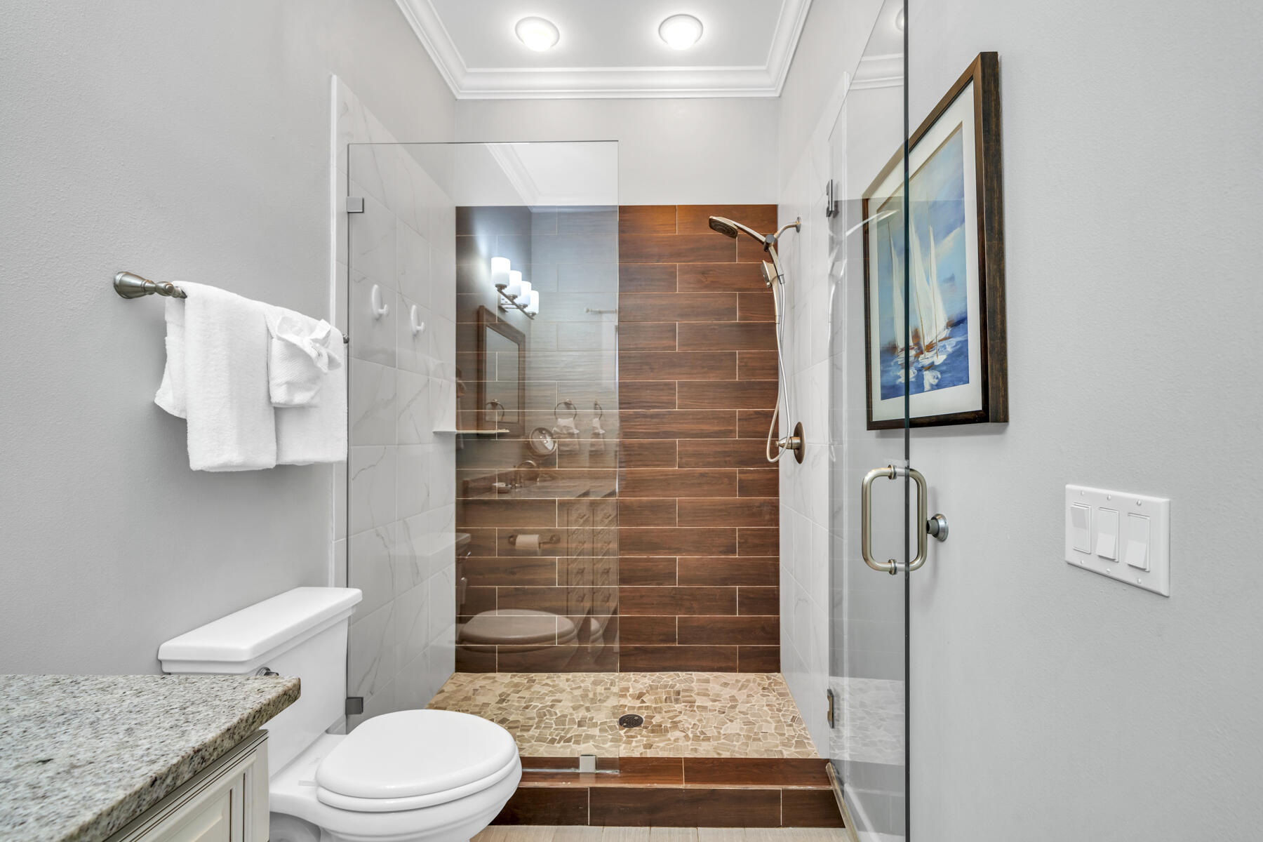 71 Emma Huggins Lane Santa Rosa Beach, FL 32459 - Photo 17 of 33 a bathroom with a granite countertop toilet a sink and shower