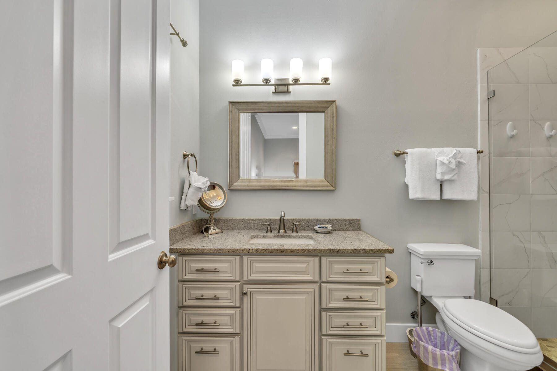 71 Emma Huggins Lane Santa Rosa Beach, FL 32459 - Photo 18 of 33 a bathroom with a sink toilet vanity and mirror