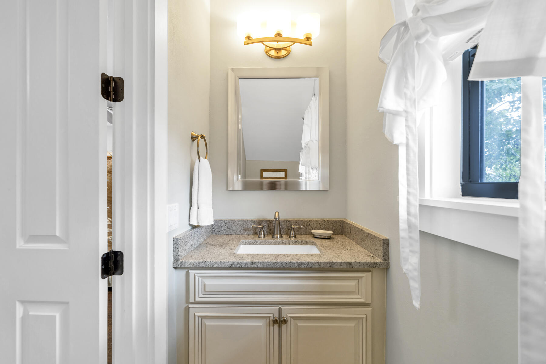 71 Emma Huggins Lane Santa Rosa Beach, FL 32459 - Photo 19 of 33 a bathroom with a granite countertop sink and a mirror