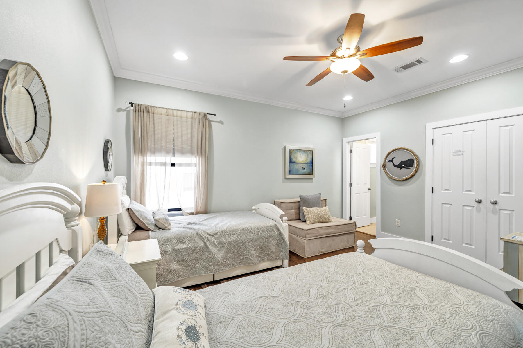 71 Emma Huggins Lane Santa Rosa Beach, FL 32459 - Photo 21 of 33 a bedroom with a bed and a chandelier