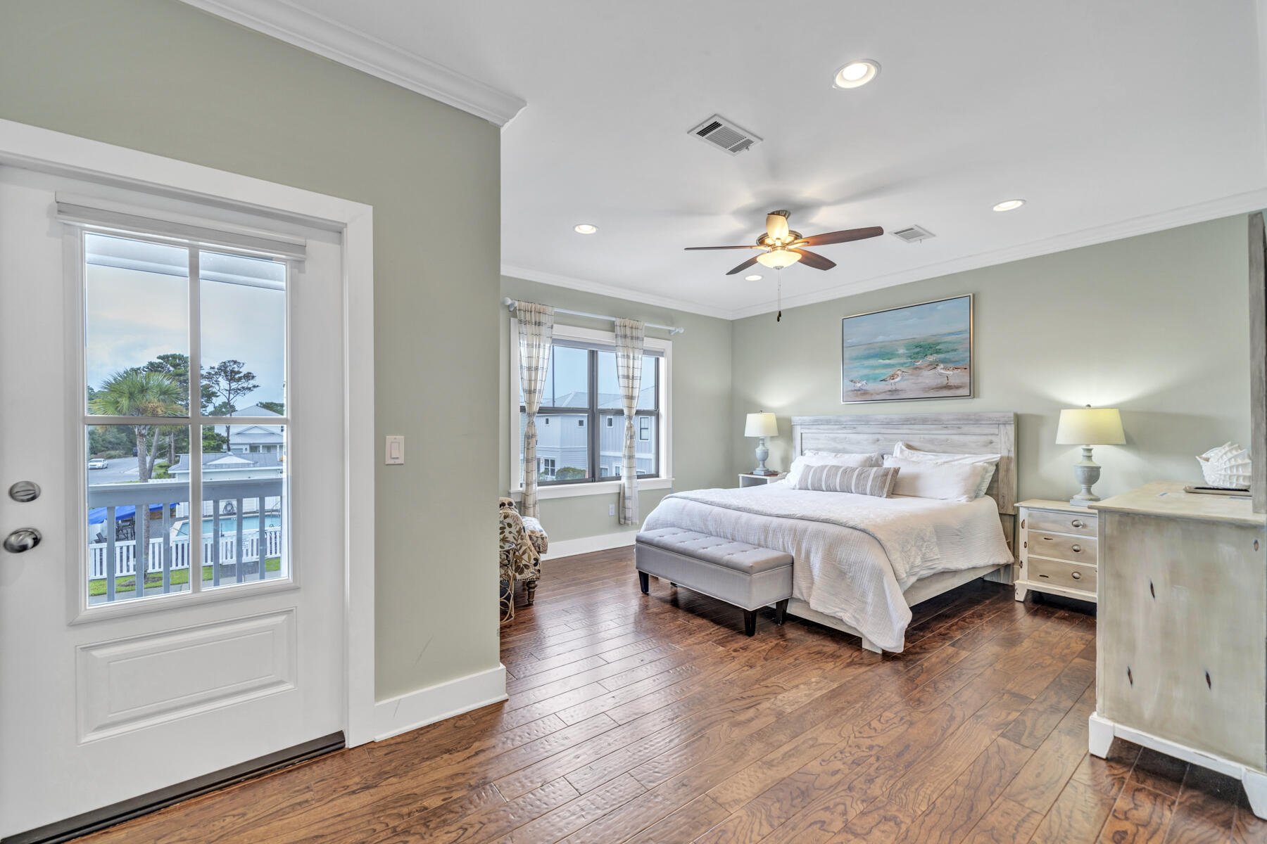 71 Emma Huggins Lane Santa Rosa Beach, FL 32459 - Photo 24 of 33 a spacious bedroom with a bed and a chandelier
