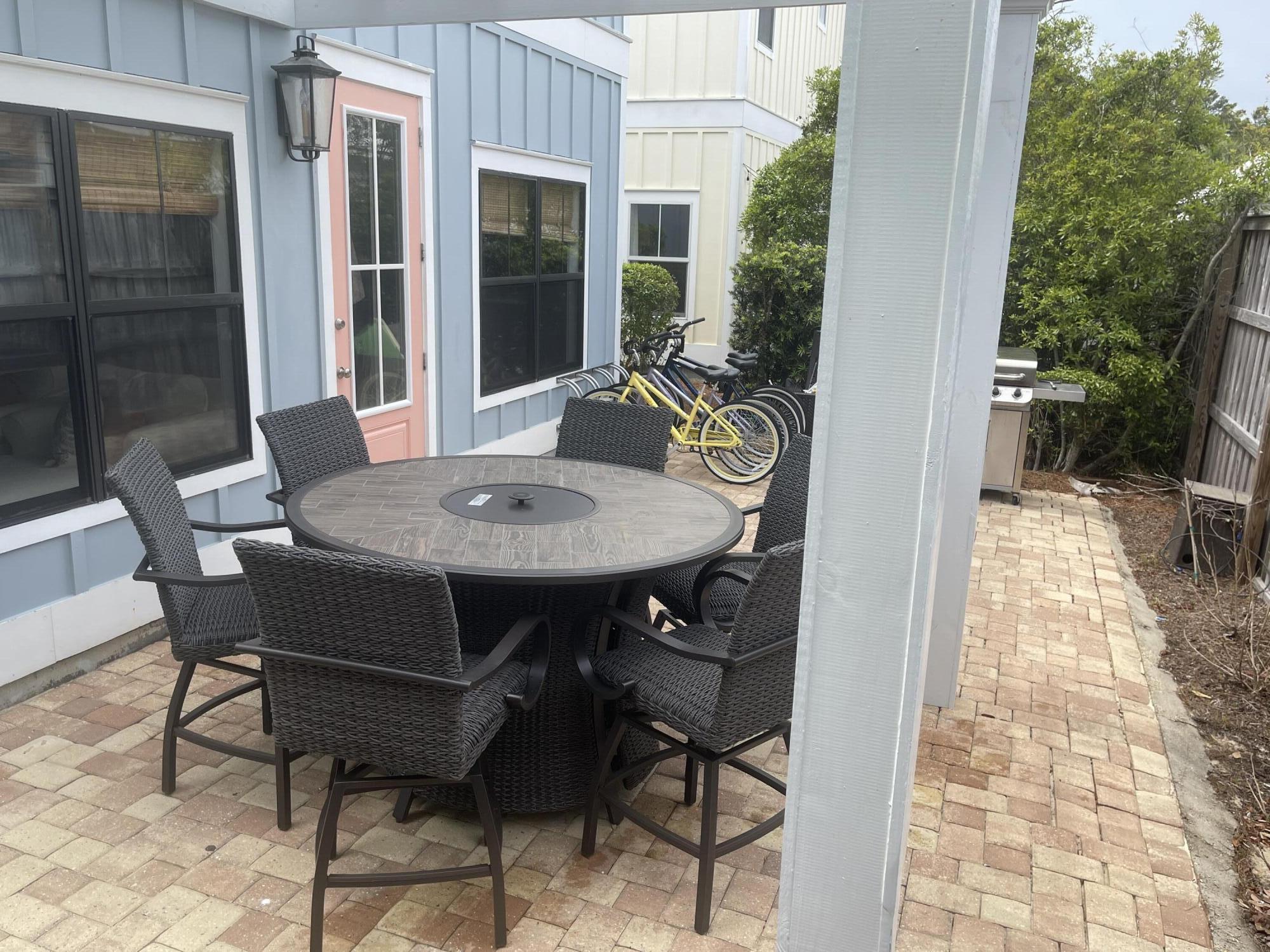 71 Emma Huggins Lane Santa Rosa Beach, FL 32459 - Photo 33 of 33 a view of a patio with table and chairs