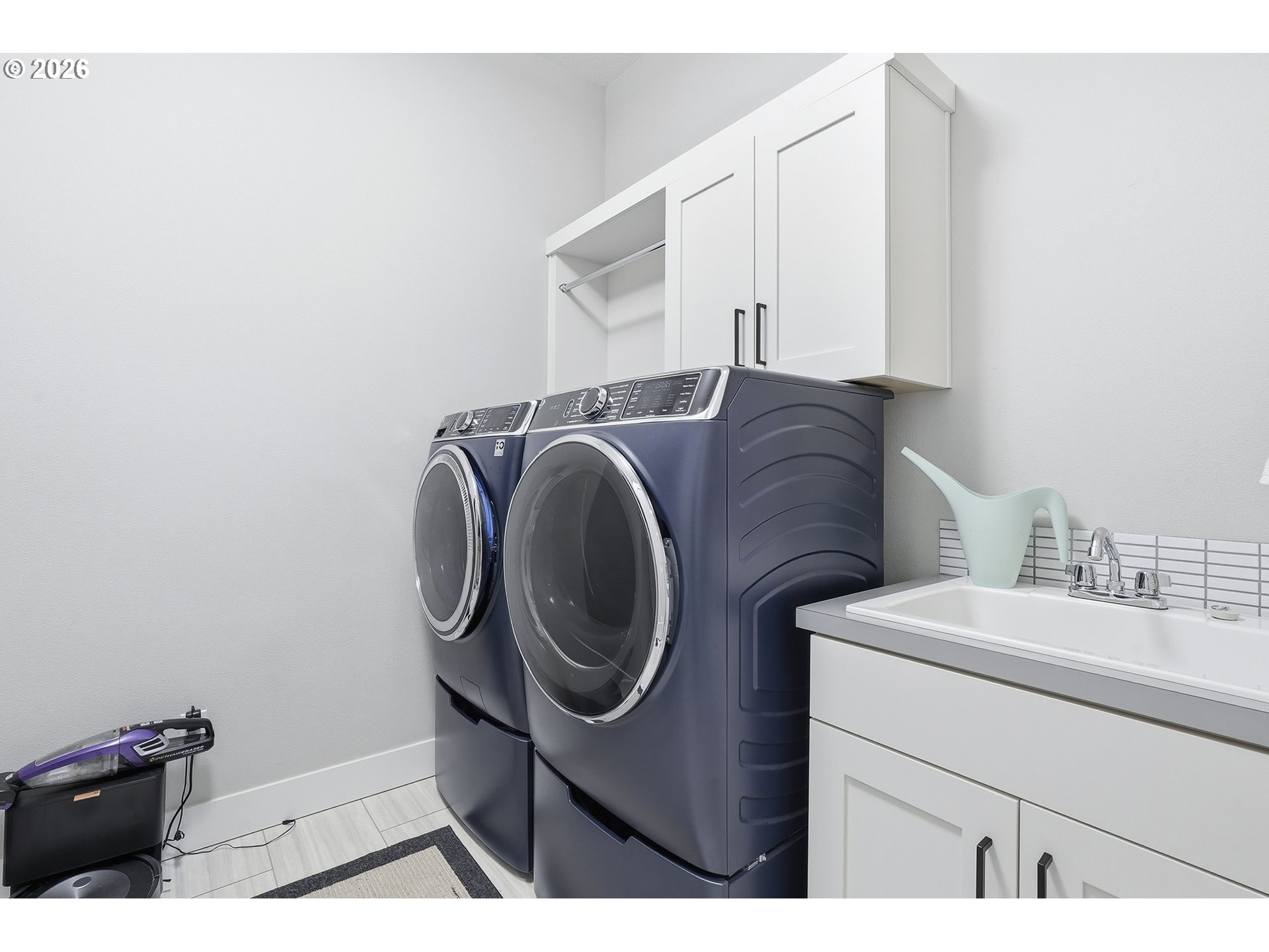 7446 Southwest 80th Terrace Portland, OR 97223 - Photo 11 of 48 a utility room with dryer and washer
