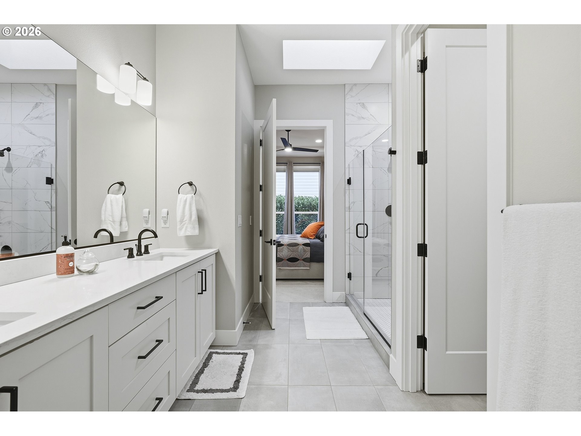 7446 Southwest 80th Terrace Portland, OR 97223 - Photo 28 of 48 a spacious bathroom with a double vanity sink mirror and shower