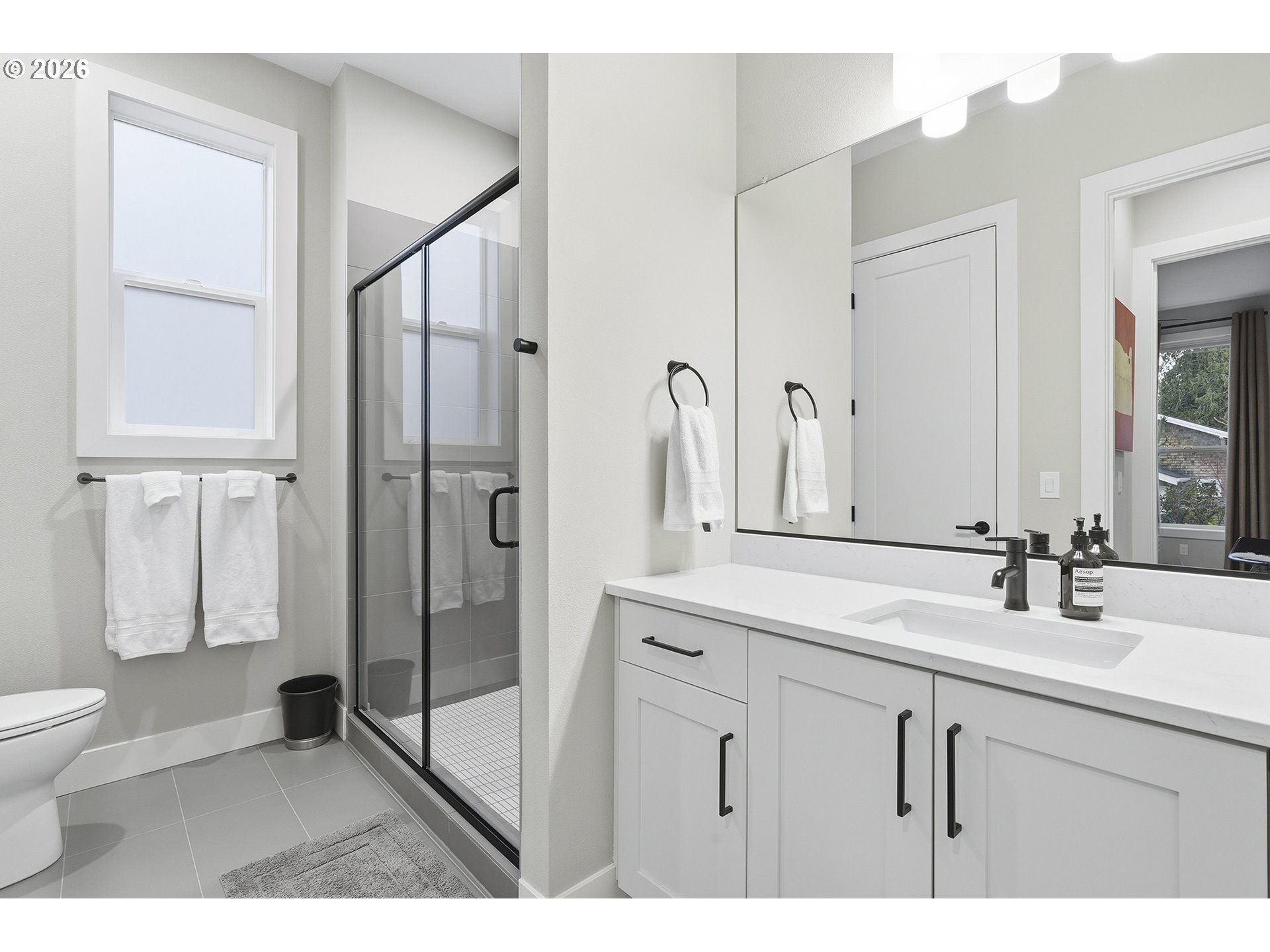 7446 Southwest 80th Terrace Portland, OR 97223 - Photo 9 of 48 a bathroom with a shower sink and toilet