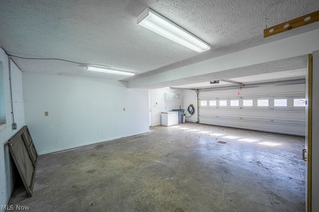 3601 River Road Vienna, WV 26105 - Photo 35 of 40 Garage featuring baseboards