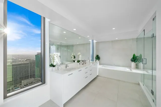 a bathroom with a bathtub and a shower