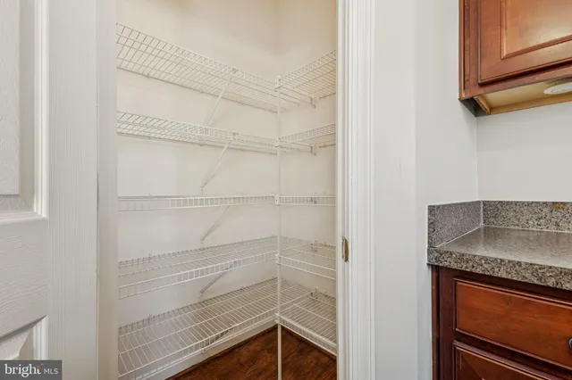 a kitchen with a refrigerator a sink and cabinets