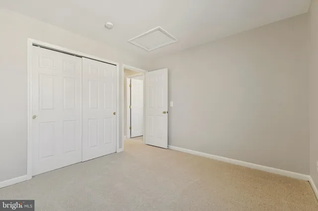 a view of room with wooden floor
