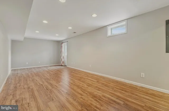 a view of a house with wooden fence