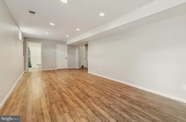 a view of a house with wooden fence