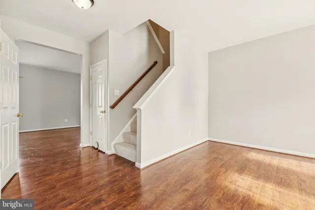 a view of an entryway with wooden floor