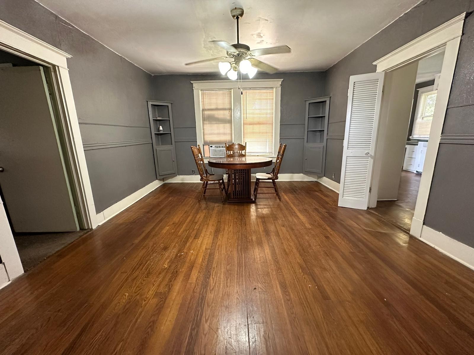 6818 Stearns Street Houston, TX 77021 - Photo 5 of 18 a view of a dining room with furniture window and wooden floor