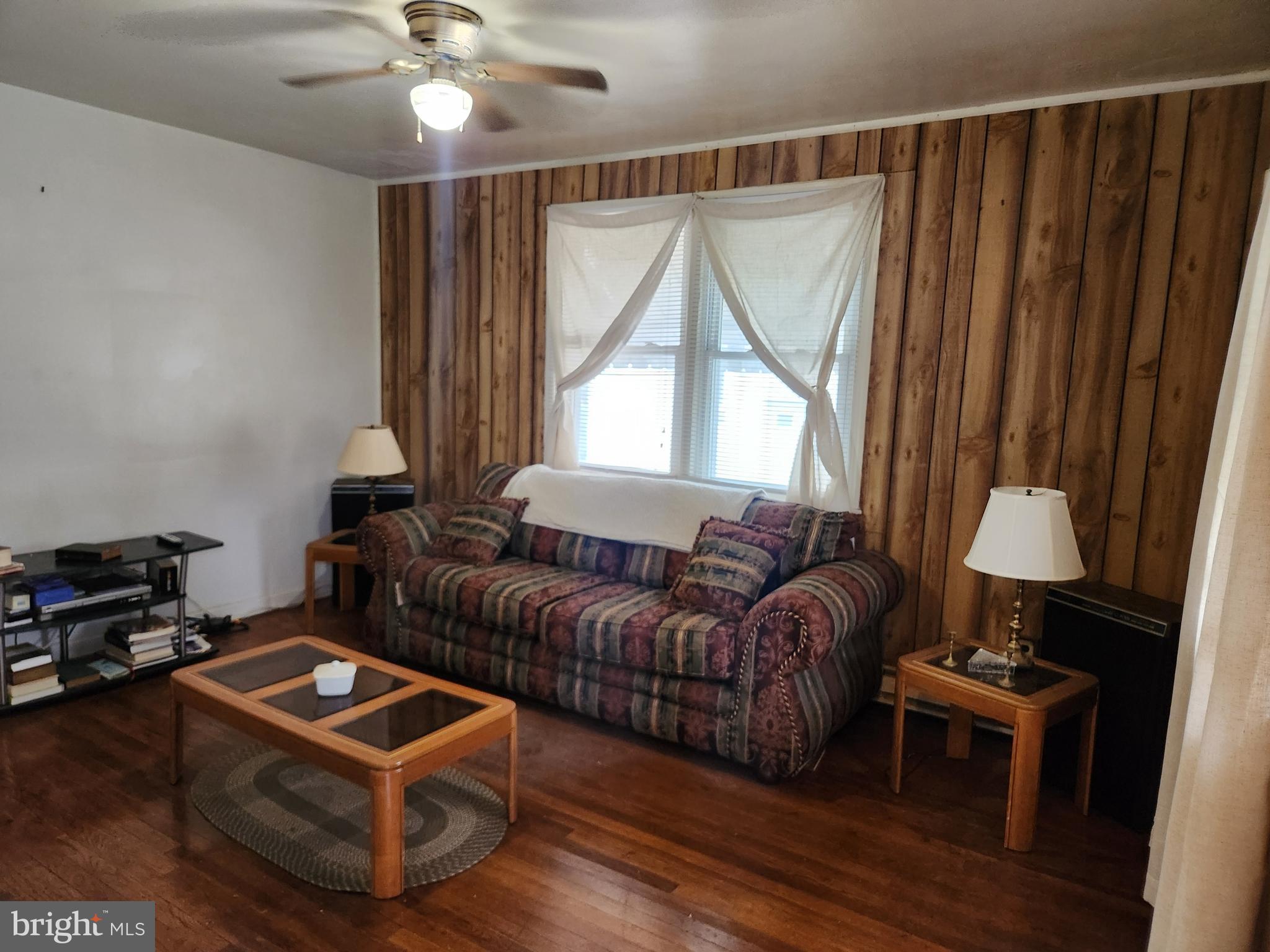 5023 Addison Road Capitol Heights, MD 20743 - Photo 3 of 17 a living room with furniture and a window