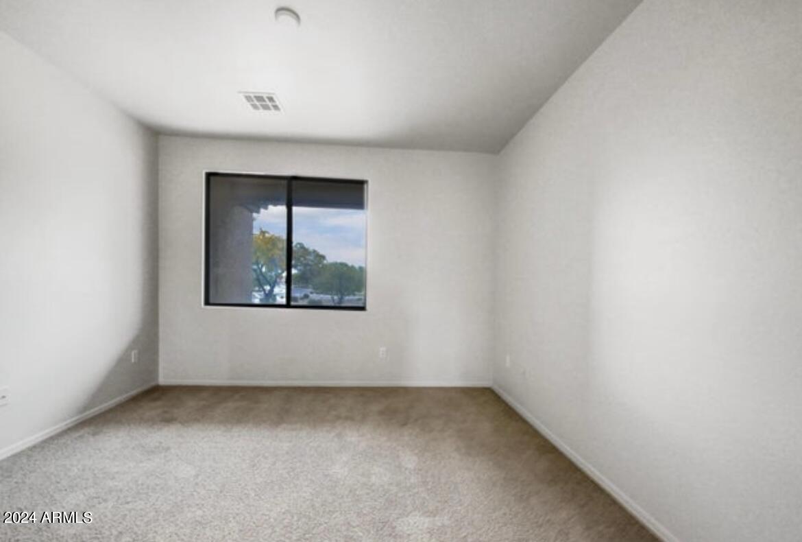 705 West Queen Creek Road, Unit 1207 Chandler, AZ 85248 - Photo 19 of 21 a view of an empty room with a window