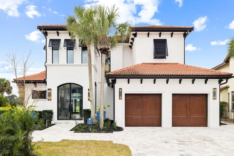 a kitchen with stainless steel appliances granite countertop a stove and a refrigerator