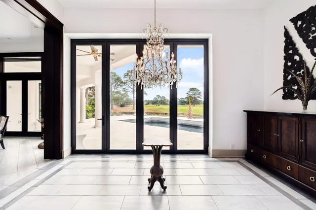 a living room with a flat screen tv and a fireplace