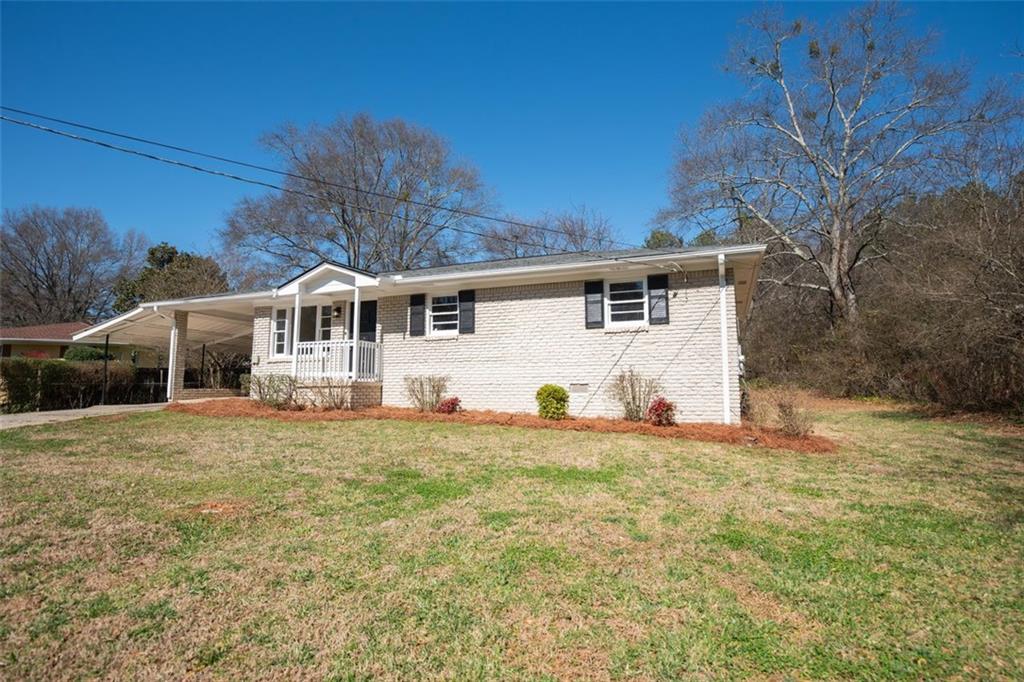 3750 Powder Springs Road Powder Springs, GA 30127 - Photo 1 of 1 a front view of house with yard and trees