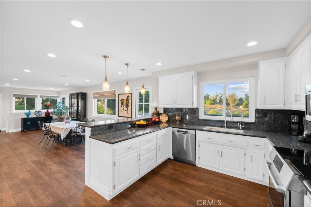 40337 Carmelita Circle Temecula, CA 92591 - Photo 11 of 65 a kitchen with lots of counter top space sink and center island