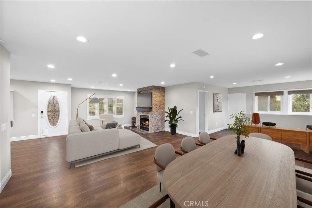 40337 Carmelita Circle Temecula, CA 92591 - Photo 12 of 65 a living room with furniture a wooden floor and a chandelier