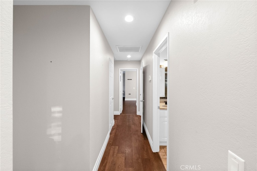 40337 Carmelita Circle Temecula, CA 92591 - Photo 14 of 65 a view of a hallway with wooden floor