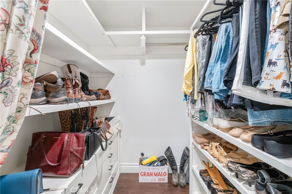 40337 Carmelita Circle Temecula, CA 92591 - Photo 21 of 65 a view of walk in closet with clothes and shoes