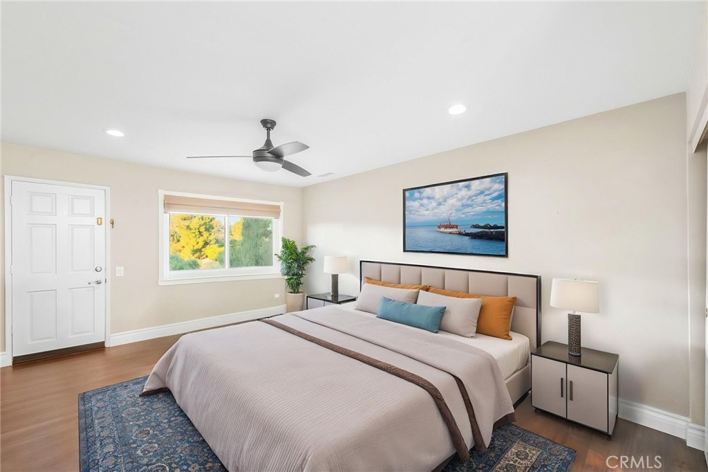 40337 Carmelita Circle Temecula, CA 92591 - Photo 24 of 65 a bedroom with a bed and a painting on the wall