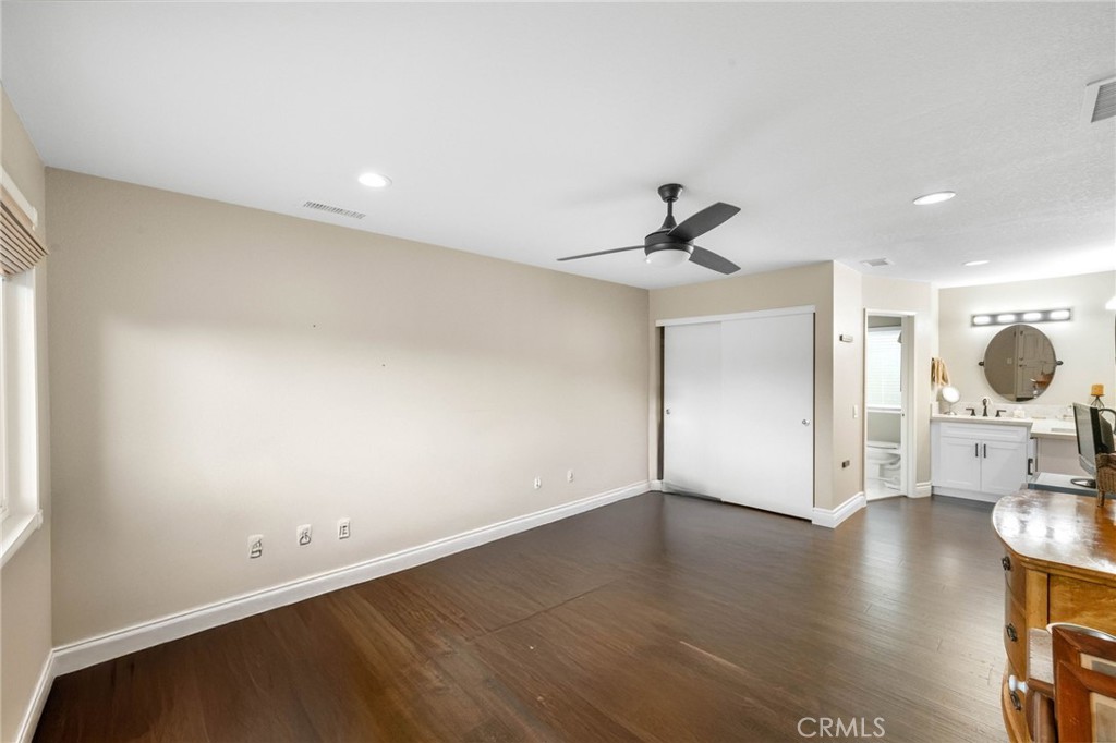 40337 Carmelita Circle Temecula, CA 92591 - Photo 25 of 65 a view of a livingroom with wooden floor and a ceiling fan