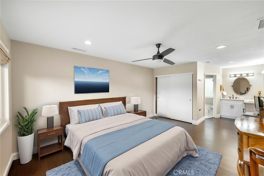 40337 Carmelita Circle Temecula, CA 92591 - Photo 26 of 65 a bedroom with a bed and wooden floor