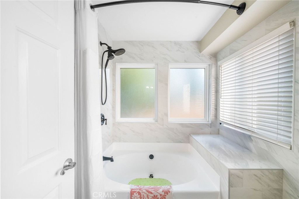 40337 Carmelita Circle Temecula, CA 92591 - Photo 29 of 65 a bathroom with a bathtub and shower