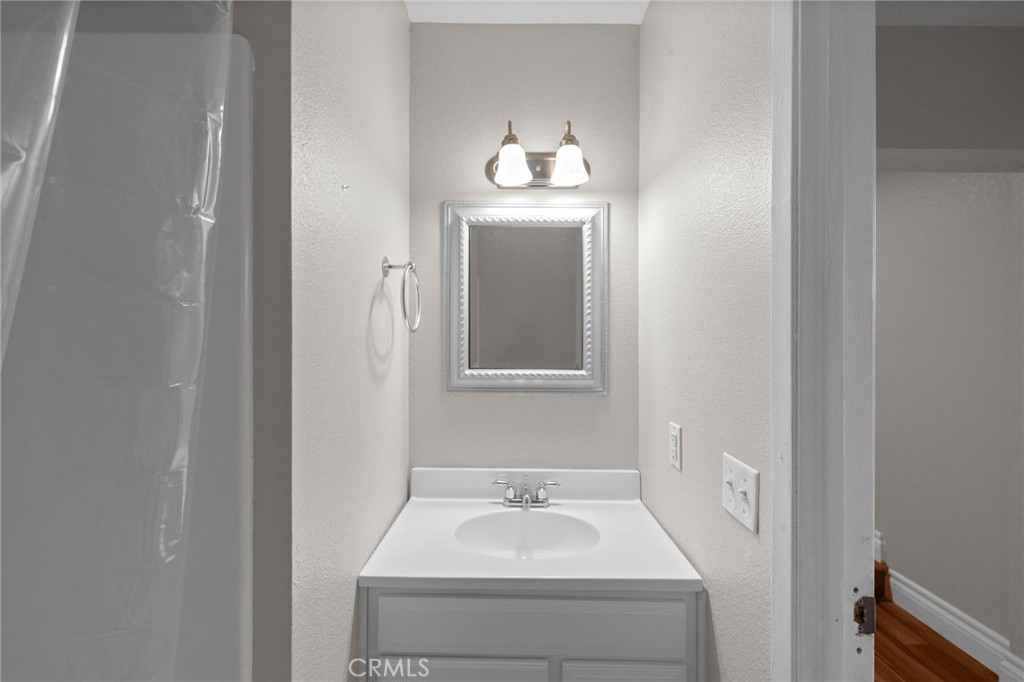 40337 Carmelita Circle Temecula, CA 92591 - Photo 35 of 65 a bathroom with a sink and a mirror