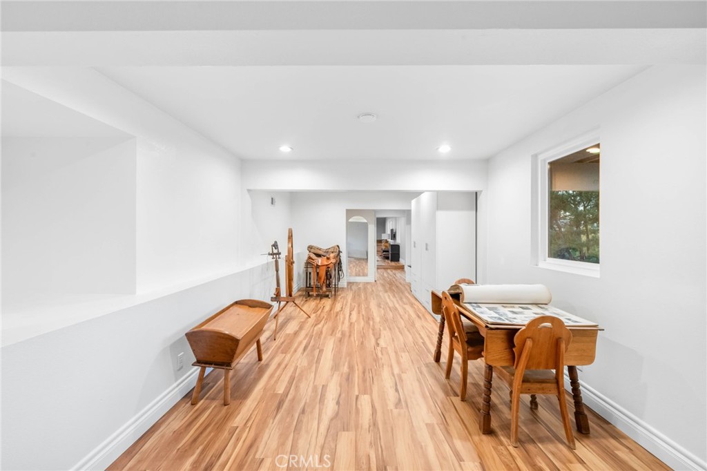 40337 Carmelita Circle Temecula, CA 92591 - Photo 39 of 65 a dining room with furniture and wooden floor