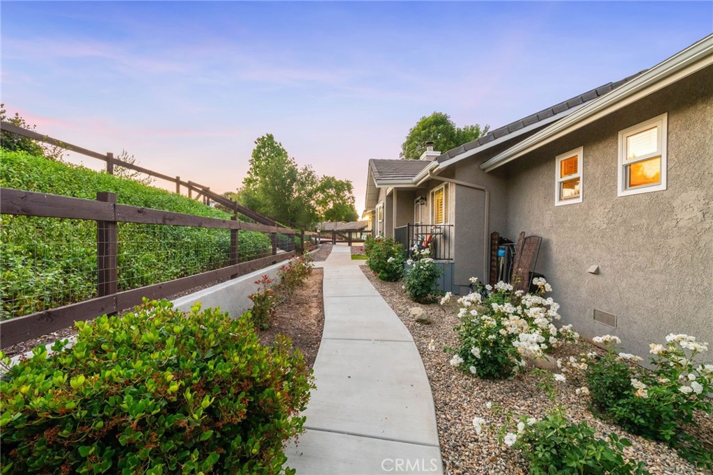 40337 Carmelita Circle Temecula, CA 92591 - Photo 63 of 65 a view of a house with a flower garden
