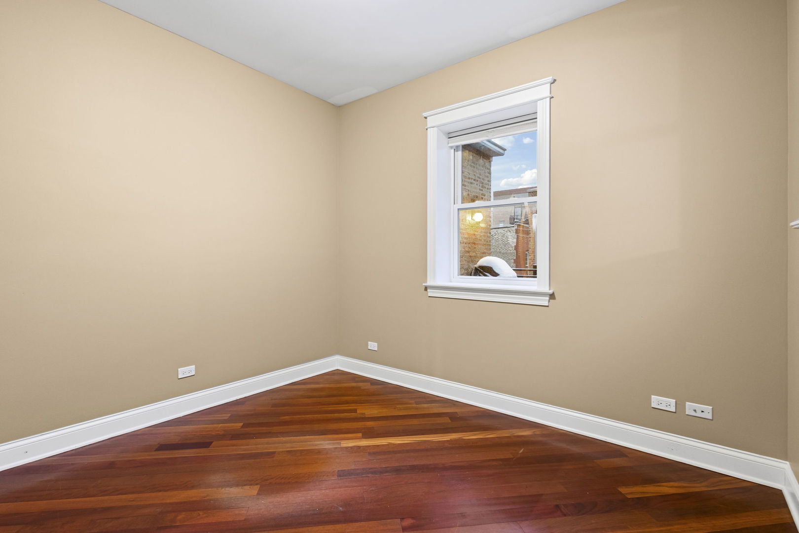 2704 West Cortland Street, Unit 3 Chicago, IL 60647 - Photo 14 of 24 a view of a room with wooden floor and windows