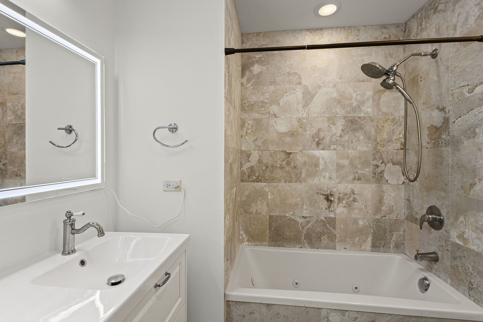 2704 West Cortland Street, Unit 3 Chicago, IL 60647 - Photo 19 of 24 a bathroom with a bath tub and a shower
