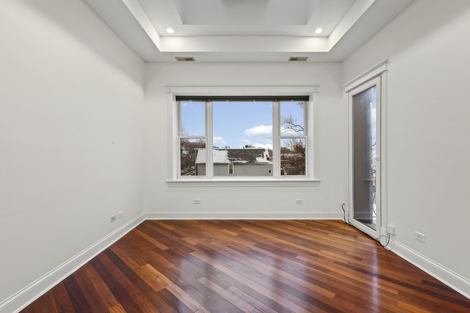 2704 West Cortland Street, Unit 3 Chicago, IL 60647 - Photo 7 of 24 an empty room with a window