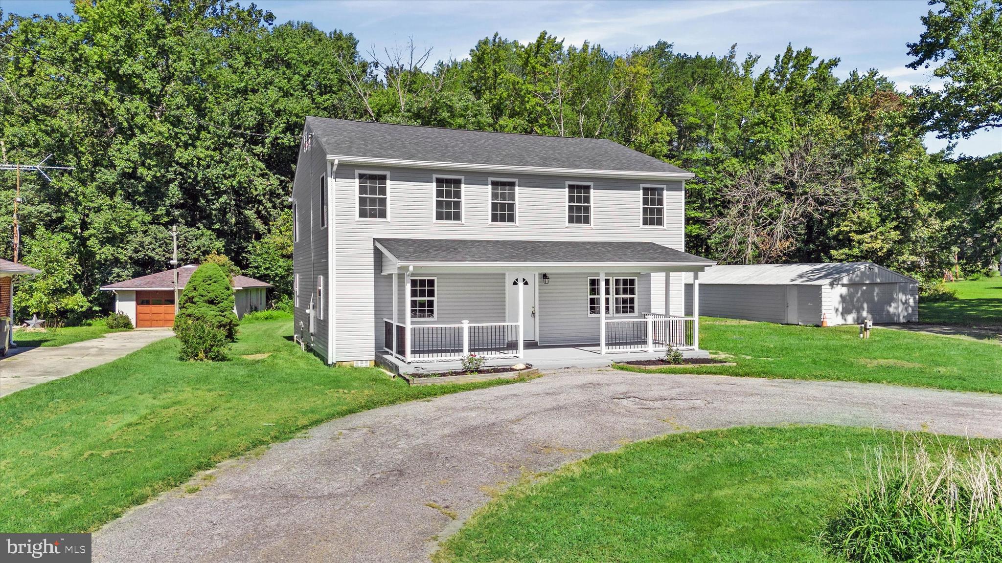 1239 Red Lion Road Bear, DE 19701 - Photo 20 of 29 front view of a house with a yard