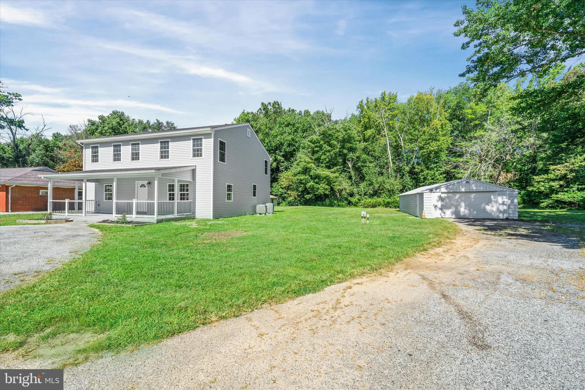 1239 Red Lion Road Bear, DE 19701 - Photo 22 of 29 a front view of house with yard and green space