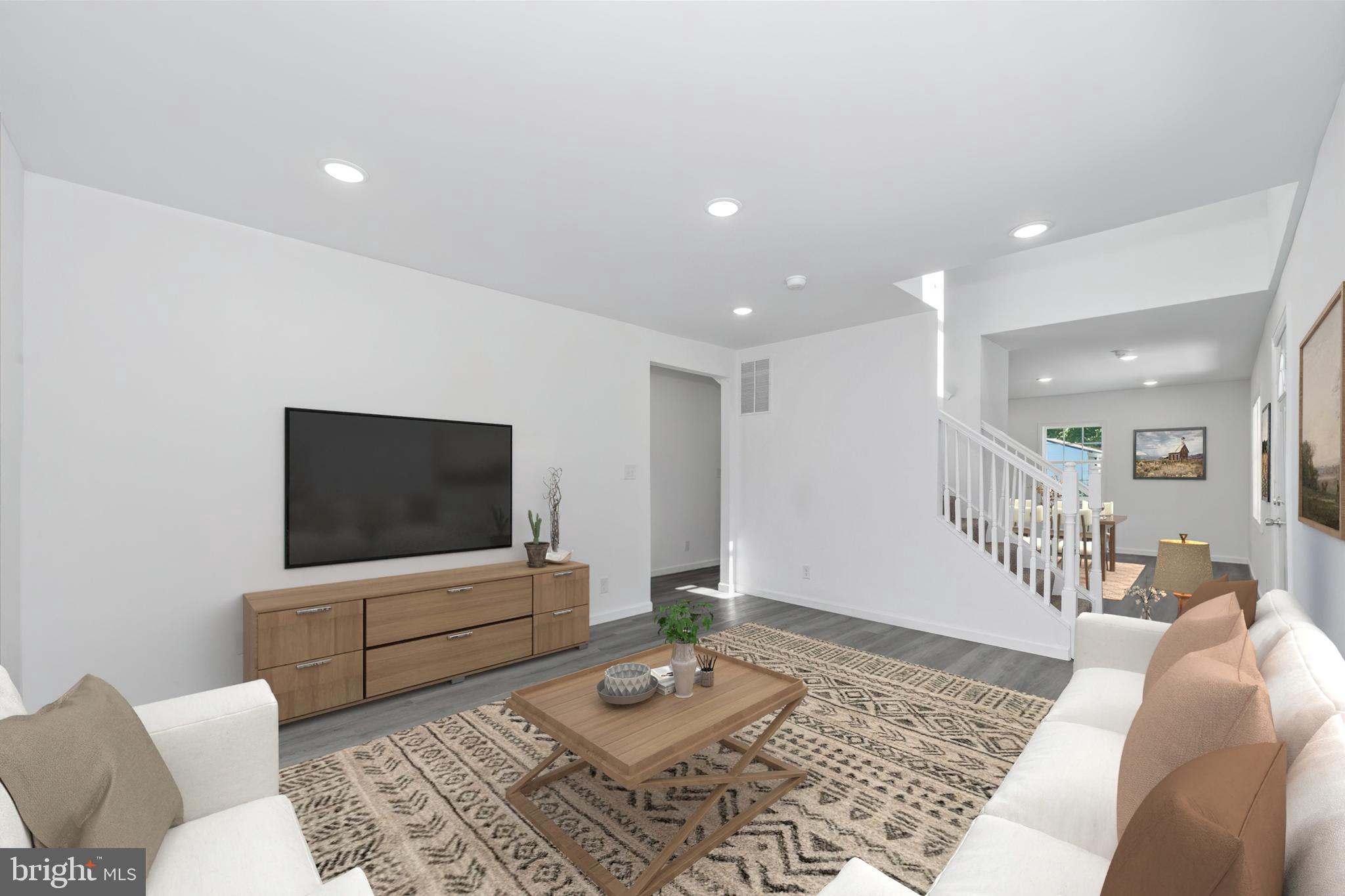 1239 Red Lion Road Bear, DE 19701 - Photo 3 of 29 a living room with furniture and a flat screen tv