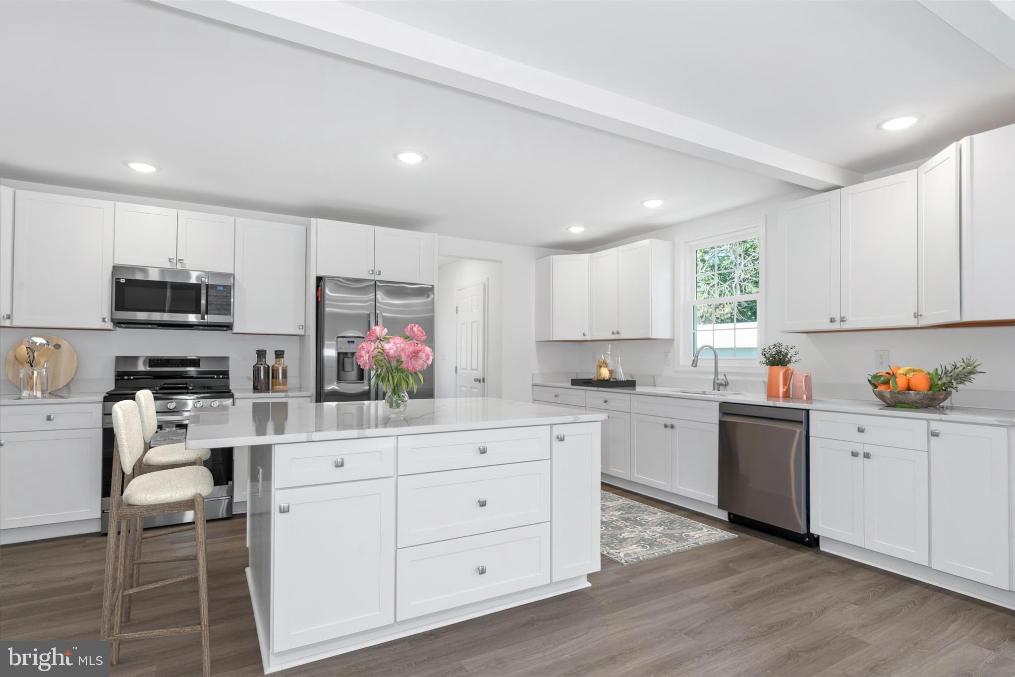 1239 Red Lion Road Bear, DE 19701 - Photo 5 of 29 a kitchen with white cabinets and white appliances