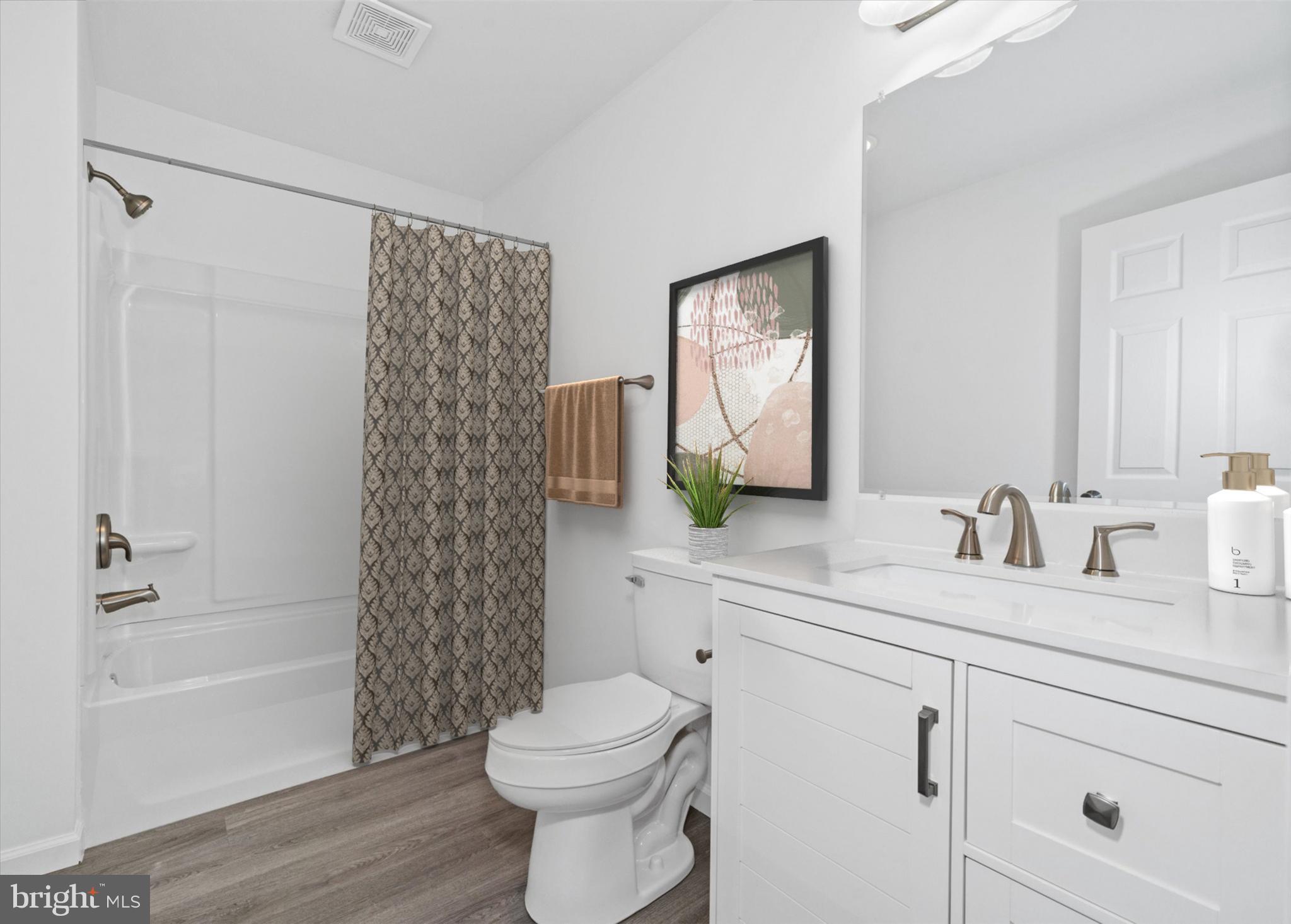 1239 Red Lion Road Bear, DE 19701 - Photo 8 of 29 a bathroom with a sink a toilet and shower