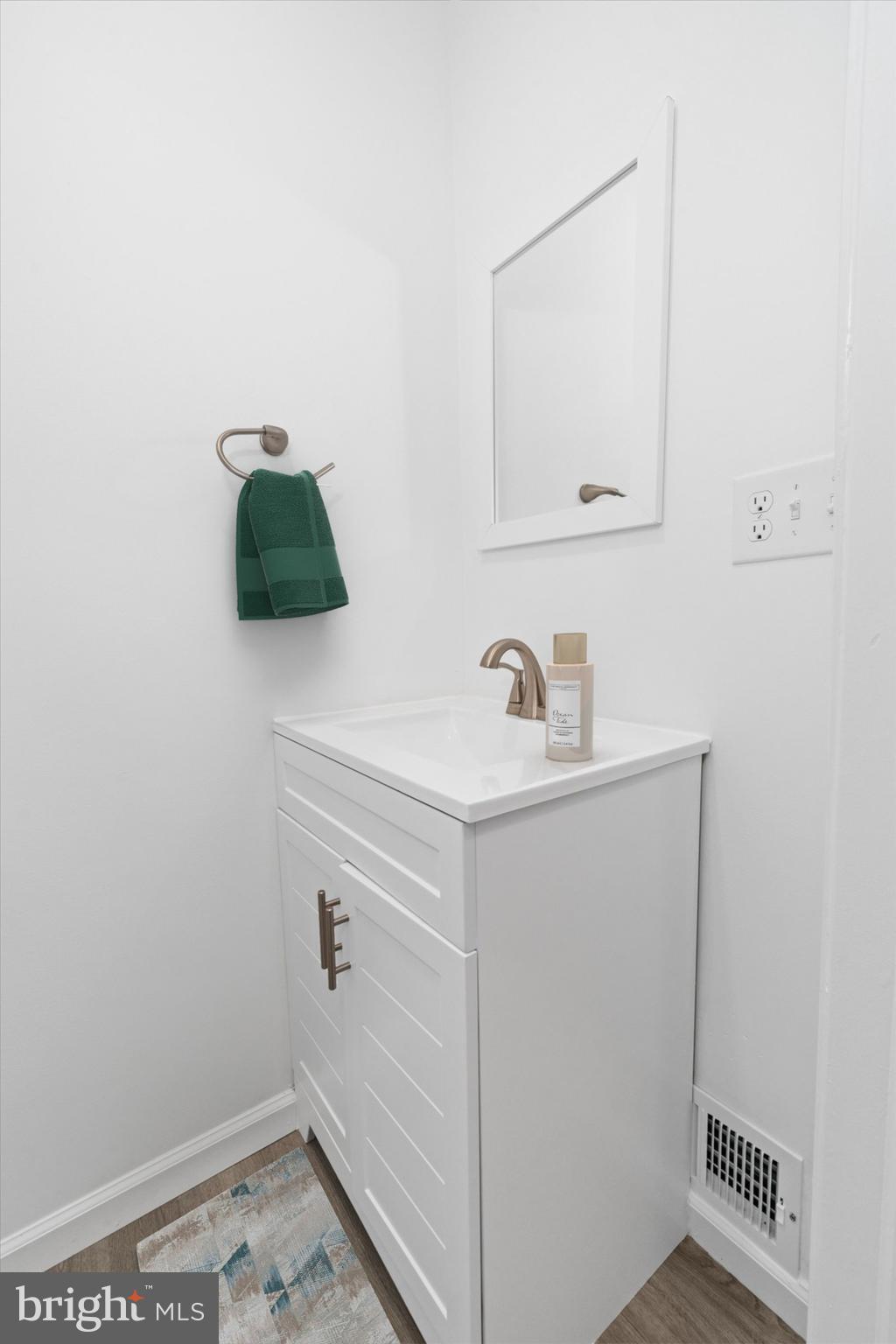 1239 Red Lion Road Bear, DE 19701 - Photo 9 of 29 a bathroom with a sink and a mirror