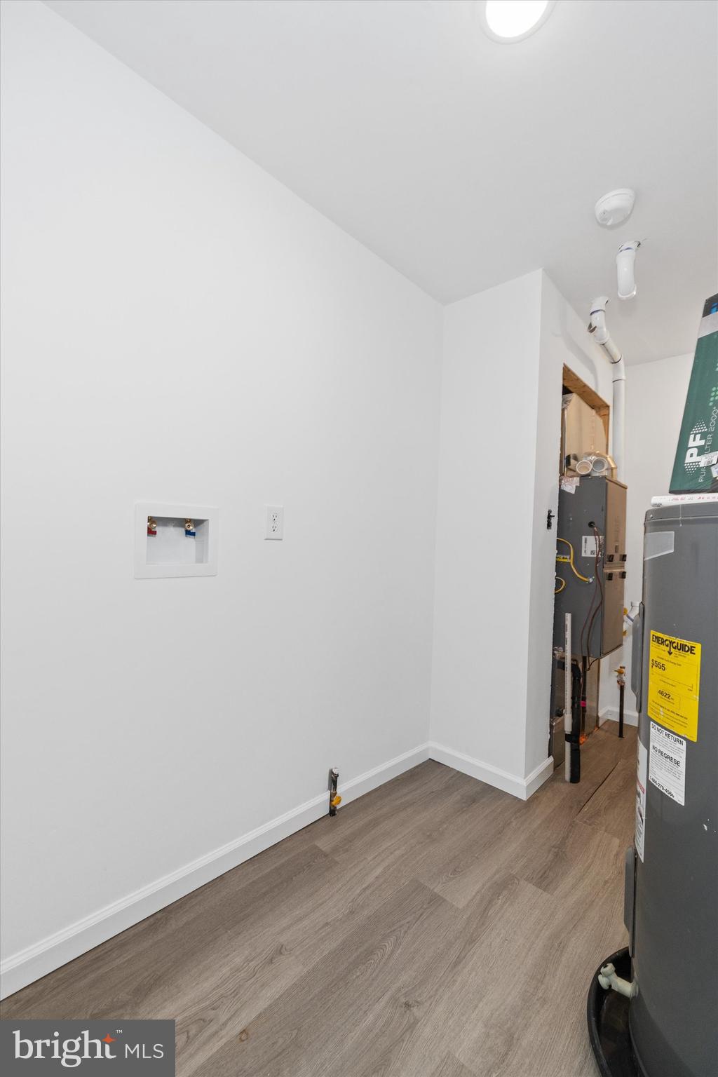 1239 Red Lion Road Bear, DE 19701 - Photo 10 of 29 a view of a room with wooden floor and a sink