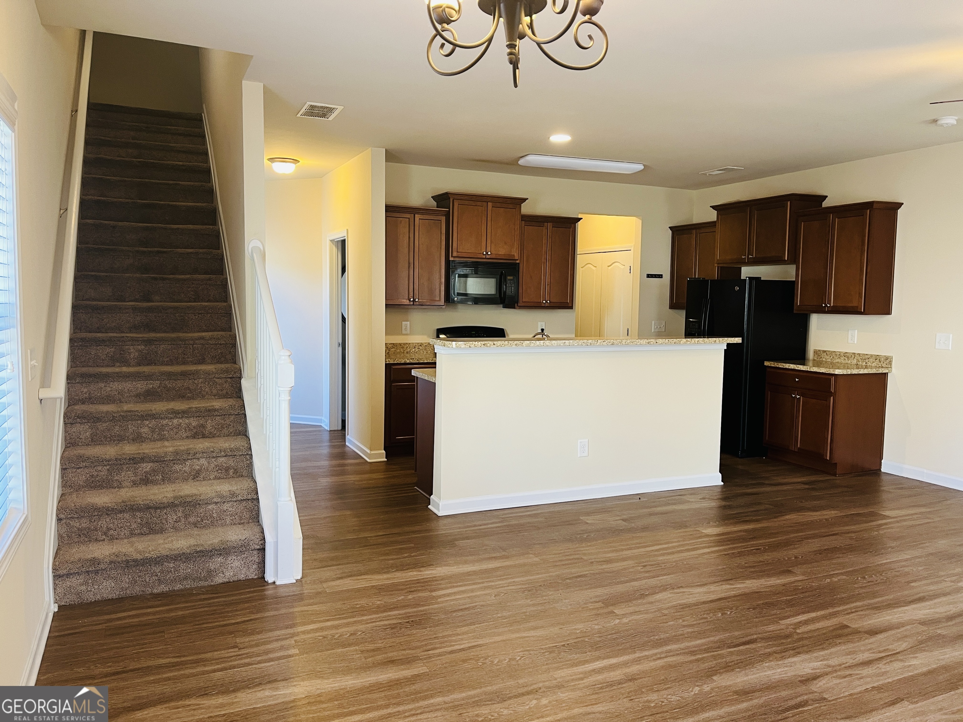 233 Bobbie Way Woodstock, GA 30189 - Photo 11 of 32 a view of kitchen with microwave refrigerator and cabinets