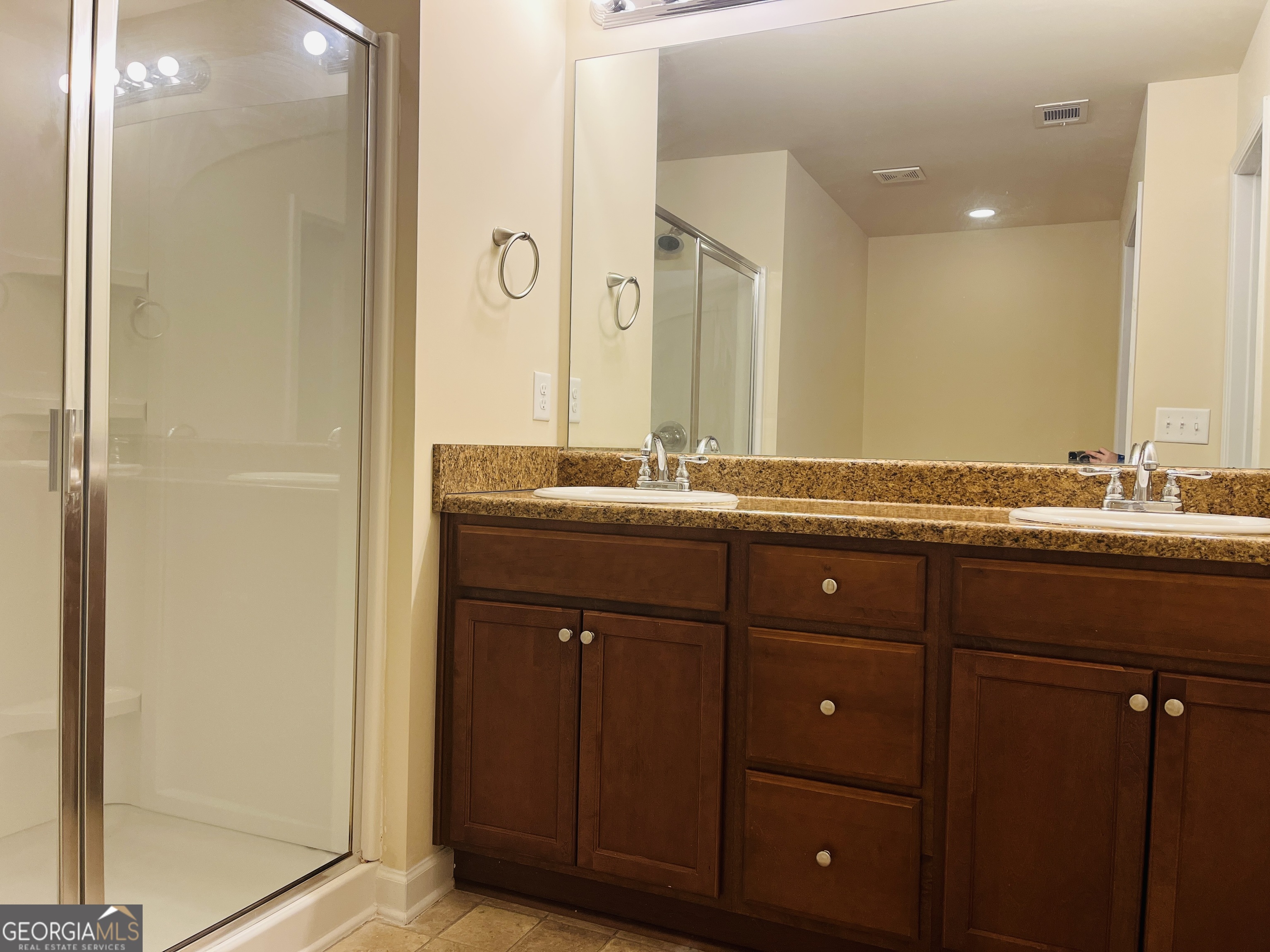 233 Bobbie Way Woodstock, GA 30189 - Photo 20 of 32 a bathroom with a granite countertop sink and a mirror