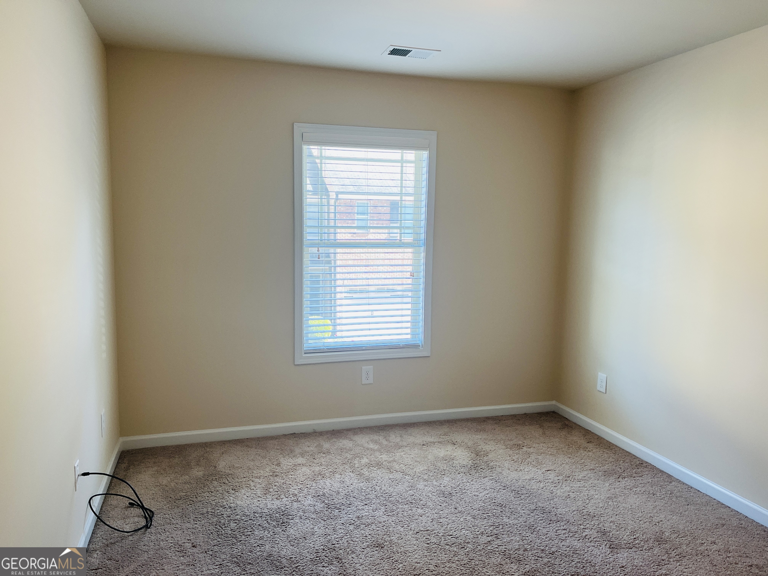 233 Bobbie Way Woodstock, GA 30189 - Photo 26 of 32 an empty room with a window
