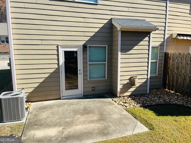 a view of a wooden deck and a yard