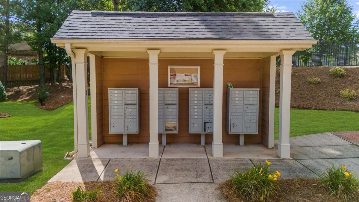 233 Bobbie Way Woodstock, GA 30189 - Photo 29 of 32 a front view of a house with a garden