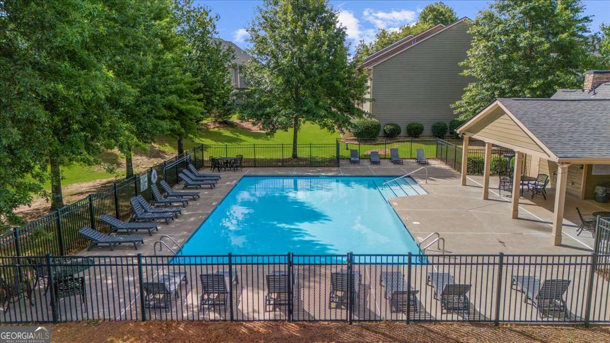 233 Bobbie Way Woodstock, GA 30189 - Photo 30 of 32 a view of a wooden deck and a yard