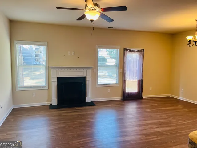 a view of an entryway with wooden floor